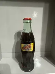 Coca-Cola 8 oz Glass Bottle-Las Vegas-Full / Sealed 2004 World of Coca Cola