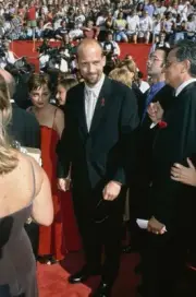 Anthony Edwards wearing a black suit over a white shirt a white t- 1998 Photo