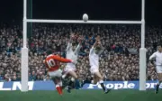 Jonathan Davies of Wales kicks a drop goal past Rob Andrew and Ja - Old Photo