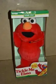 A TYCO SESAME STREET TICKLE ME ELMO - NEW NEEDS NEW BATTERIES