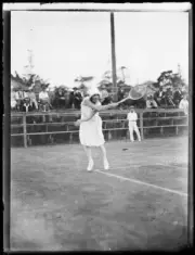 Mrs J Cassidy jumping to make a high shot during a tennis match, NS- Old Photo