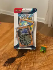 Sealed Booster Pack + Rare Cosmos Holo + Pikachu Coin - Sv04: Paradox Rift