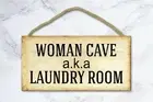 plaque of accent walls in living room woman cave aka laundry room wood sign