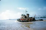 The tugboat Orleans moves out to sea in New Orleans Louisiana 1957 Old Photo 1