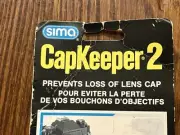 Sima CapKeeper 2 For All Interchangeable Lenses, Movie & Video Cameras - New