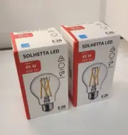 IKEA SOLHETTA LED bulb E26 450 lumen, Glass globe clear 2700 K (SET OF 2)
