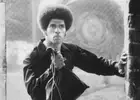 Jim Kelly carries a sack full of stolen mob money in the 1974 mart- Old Photo