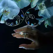 Silver jewelry set with Ethiopian opals. Earrings and ring.