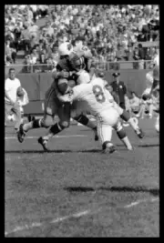 Green Bay Packers Fullback Jim Taylor gets tackled during the St L- Old Photo