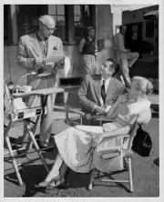 Director Mitchell Leisen and actors Glenn Ford and Nina Foch on th- Old Photo 1