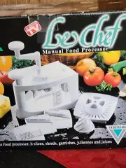2947. NEW "LE CHEF" MANUAL FOOD PROCESSOR SLICES, SHREDS,JUICES ECT 12 PIECE