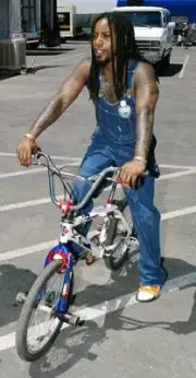 Sevendust singer Lajon Witherspoon rides a bicycle backstage befor - Old Photo