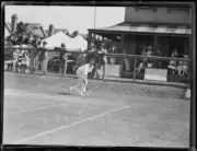 E. Budroden hitting a forehand shot on the baseline during a tenni- Old Photo