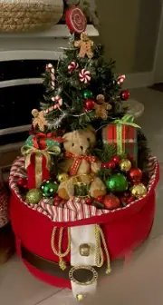 Christmas tree in a Ssnta sack Lights Up Battery Operated Table Top Decor