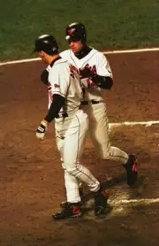 Todd Zeile Baltimore Orioles is congratulated by Brady Anderson af- Old Photo
