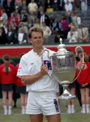 Stefan Edberg of Sweden poses with the trophy after defeating Davi- Old Photo
