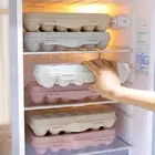 Orange Plastic Egg Storage Box with Lid for Neat Refrigerator Organization