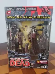 Previews Exclusive McFarlane Walking Dead Bloody Michonne and Rick Figures