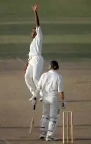 West Indies fast bowler Courtney Walsh celebrates as England'- Old Cricket Photo