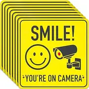 ASSURED SIGNS Smile You're On Camera Sign - 8 Pack - 7 X 7 Inch - Yellow Vinyl Signs - Playful Cautionary Style - Perfect for Home, Office, Supermarket, Swimming Pool, Parking Area, Yard