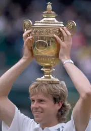 Stefan Edberg of Sweden lifts the trophy after defeating Boris Be - Old Photo 3