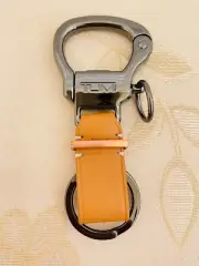 TUMI Keychain KEY Fob Ring Bottle Opener Leather TAN color Key Charm Travel NEW