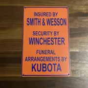 Funny Saying Metal Sign “Insured By Smith & Wesson…”