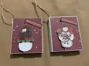 SET OF 2 HANDMADE 2 1/2” X 3” SCRAPBOOK CHRISTMAS TREE ORNAMENTS- Snowmen