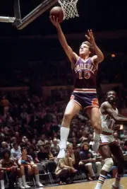 Don Buse Phoenix Suns lays the ball up over Earl Monroe New York K- Old Photo