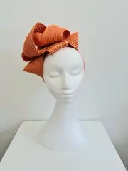 Miss Samantha. Womens loop headband fascinator in Soft Orange