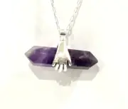 Hands Holding Chevron Amethyst Two Pointed Pendent With Chain