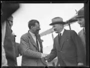 Aviator F.C. Chichester shaking hands with another man in front of- Old Photo