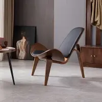 在飛比找樂天市場購物網優惠-北歐實木椅子ins網紅椅設計師創意簡約單人沙發椅 微笑飛機貝