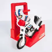 Evel Knievel Stunt Cycle, the Amazing Wind up and Go Action Toy Launcher 8" Bike
