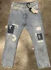 PALM ANGELS DISTRESSED PATCHWORK JEANS