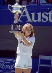 Steffi Graf of Germany lifts the trophy after defeating Helena Su - Old Photo