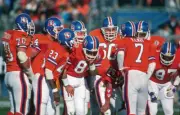 Quarterback John Elway Denver Broncos huddles with the offense, in- Old Photo