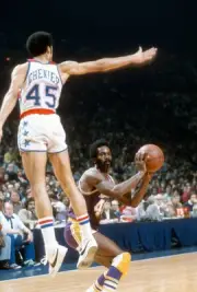 Lucius Allen Los Angeles Lakers looks to pass the ball by Phil Ch- 1976 Photo