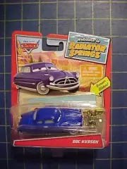 DISNEY PIXAR CARS WELCOME TO RADIATOR SPRINGS DOC HUDSON WITH PISTON CUP! NIP