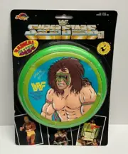 1990 Titan Sports WWF Superstars ULTIMATE WARRIOR Radical Flying Green Disc NEW