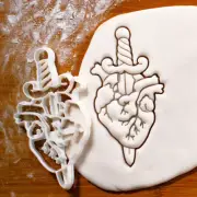 Dagger in Anatomical Heart cookie cutter Macabre heartbroken heartache biscuit