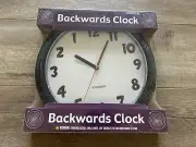 Archie McPhee Accoutrements Backwards Clock New & Sealed Novelty NOS
