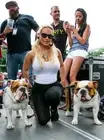 Personality Coco Austin poses with her dogs backstage at the Roc- 2014 Photo