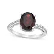 Oval Garnet and Natural Diamond Accent Ring in Sterling Silver