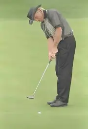 Greg Norman hits the ball at the Andersen Consulting World Champio- Old Photo