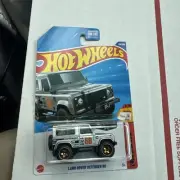 2025 Hot Wheels THEN AND NOW 5/10 Land Rover Defender 90 (Zamac) with protector
