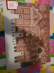 Festive Houses Decorated With Christmas Wreaths Lights Snowflakes And Pine Trees