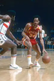 Auston Carr Cleveland Cavaliers looks to drive on Truck Robinson - 1976 Photo