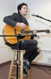 Actor Jared Leto plays backstage for radio contest winners before - Old Photo