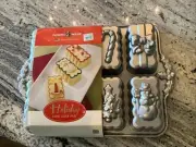 Nordic Ware Christmas Holiday Mini Loaf Bundt Baking Pan Cakes 8 Platinum Collec